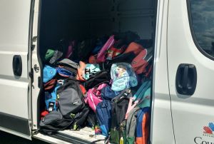 Backpack program van filled with backpacks